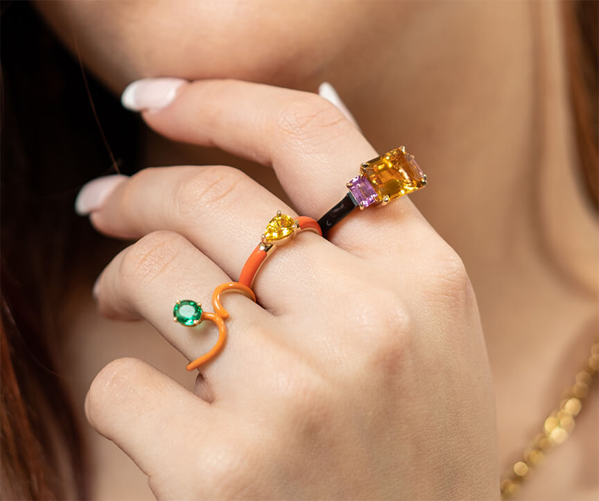 yellow sapphire set in 18k yellow gold and orange ceramic