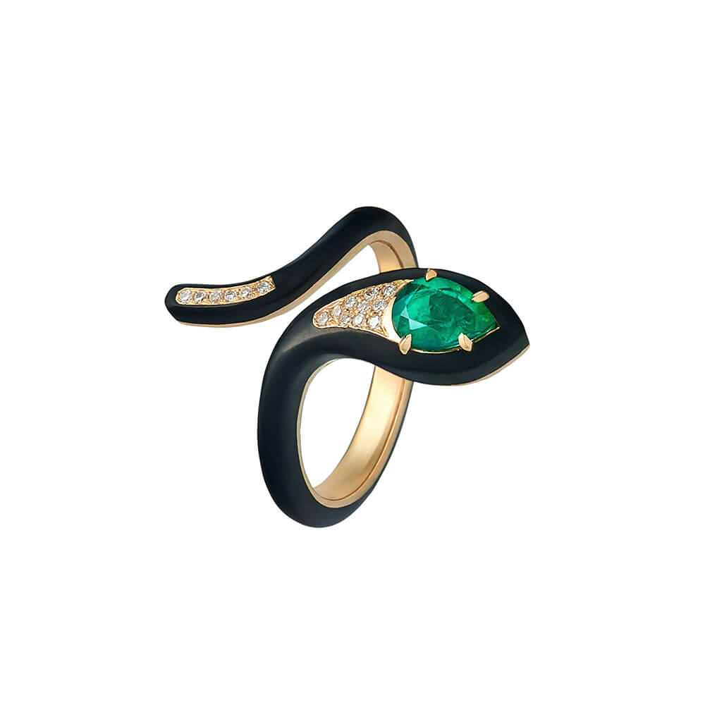 colombian emerald and round diamonds set in 18 karat yellow gold with black ceramic ring
