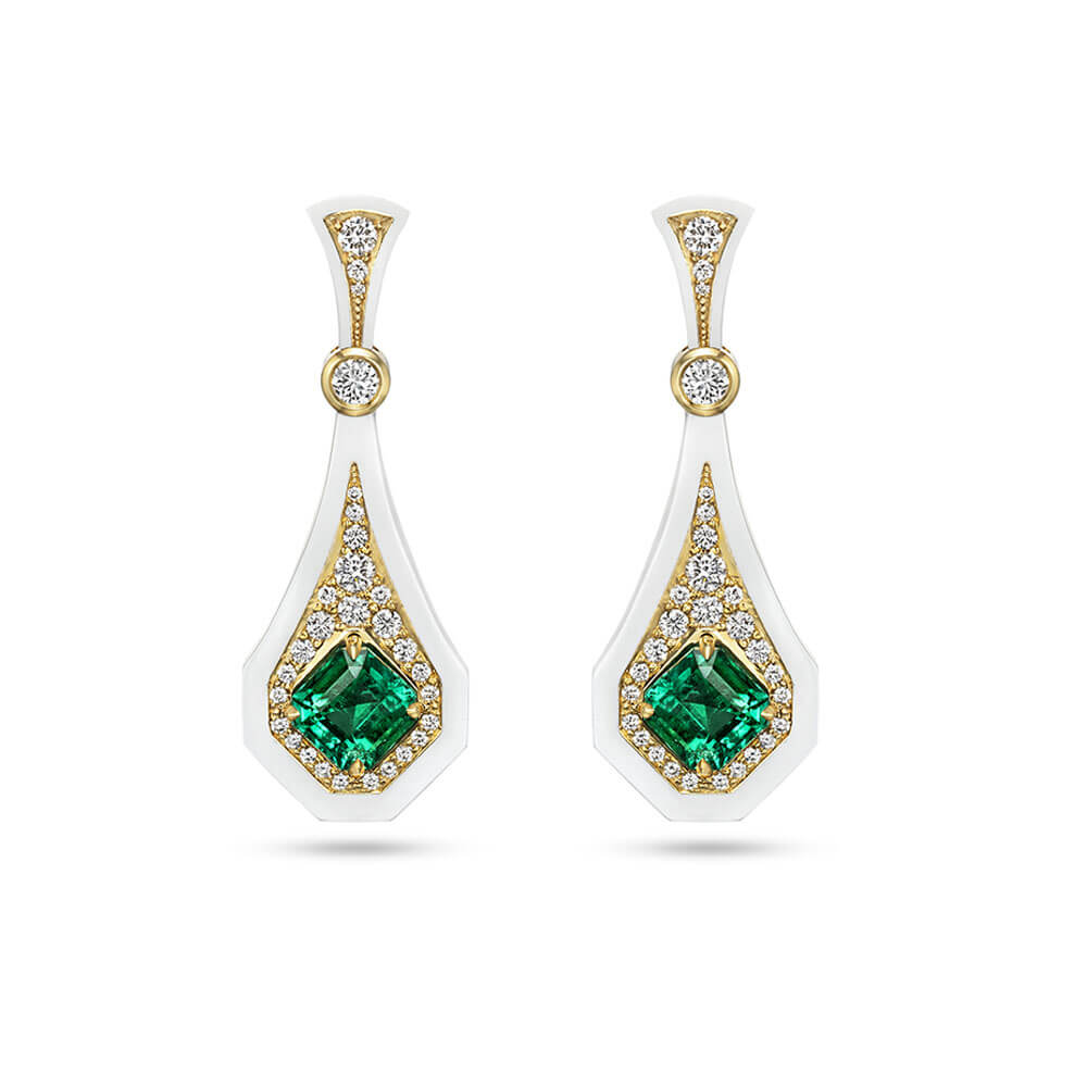 gia certified colombian emeralds and diamonds set in 18 karat yellow gold and white ceramic
