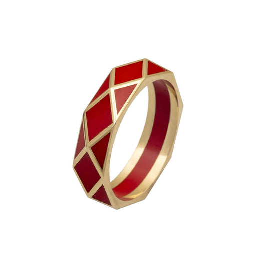 geometric ring band crafted in 18 karat yellow gold and red ceramic