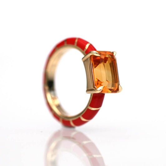 yellow citrine 11 X 9 mm set in 18 carat yellow gold and red ceramic